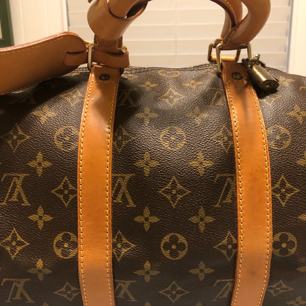 Authentic Louis Vuitton “Keep All” duffel bag.